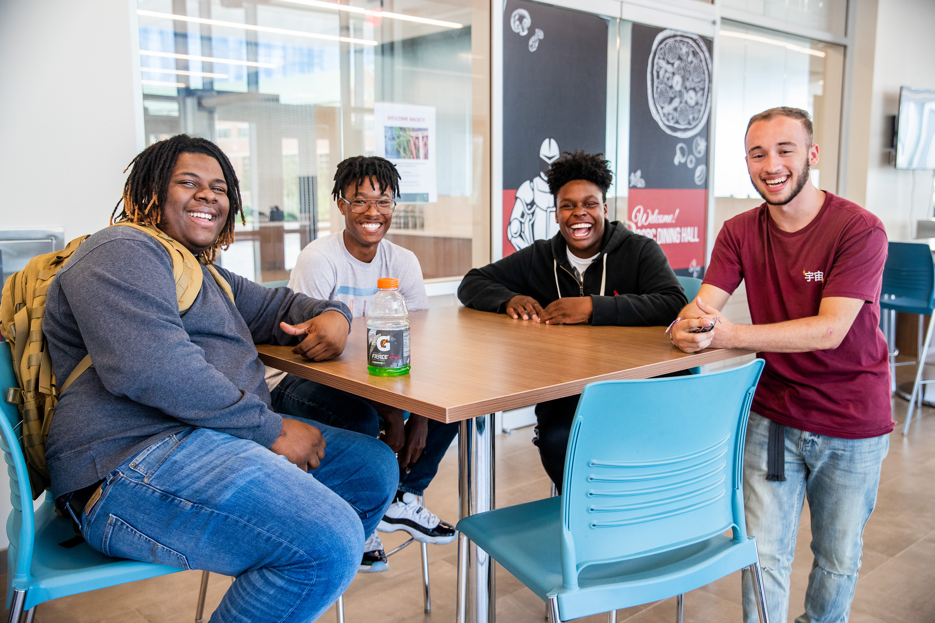 group of students sitting at a table in the Student Success Center