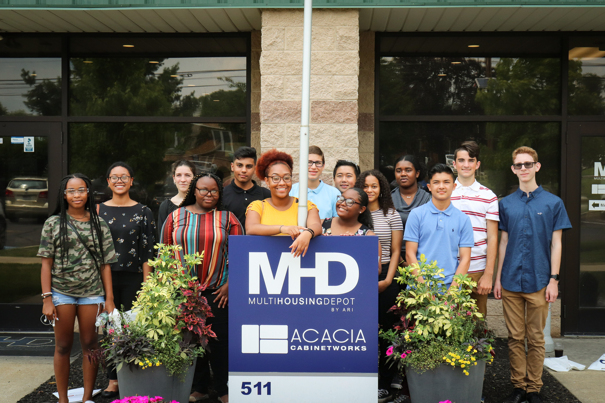 high school students standing in front of MHD