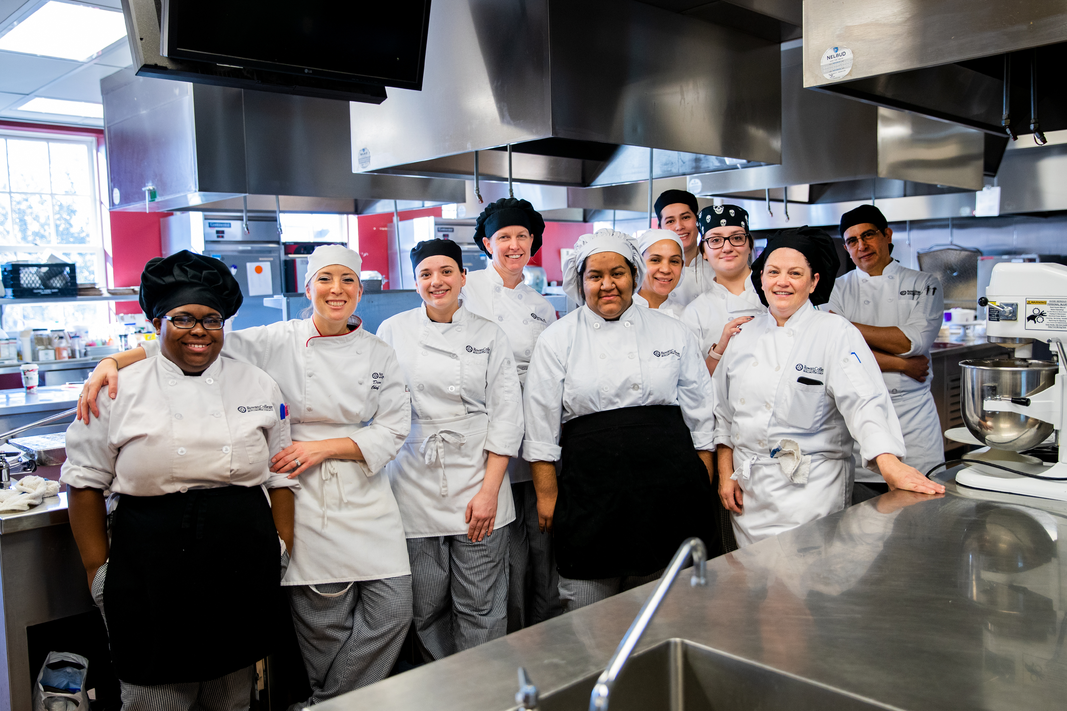 culinary students standing side-by-side in RCBC kitchen