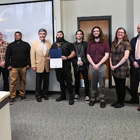 Image of RCBC's award-winning student cybersecurity team with county and college officials.