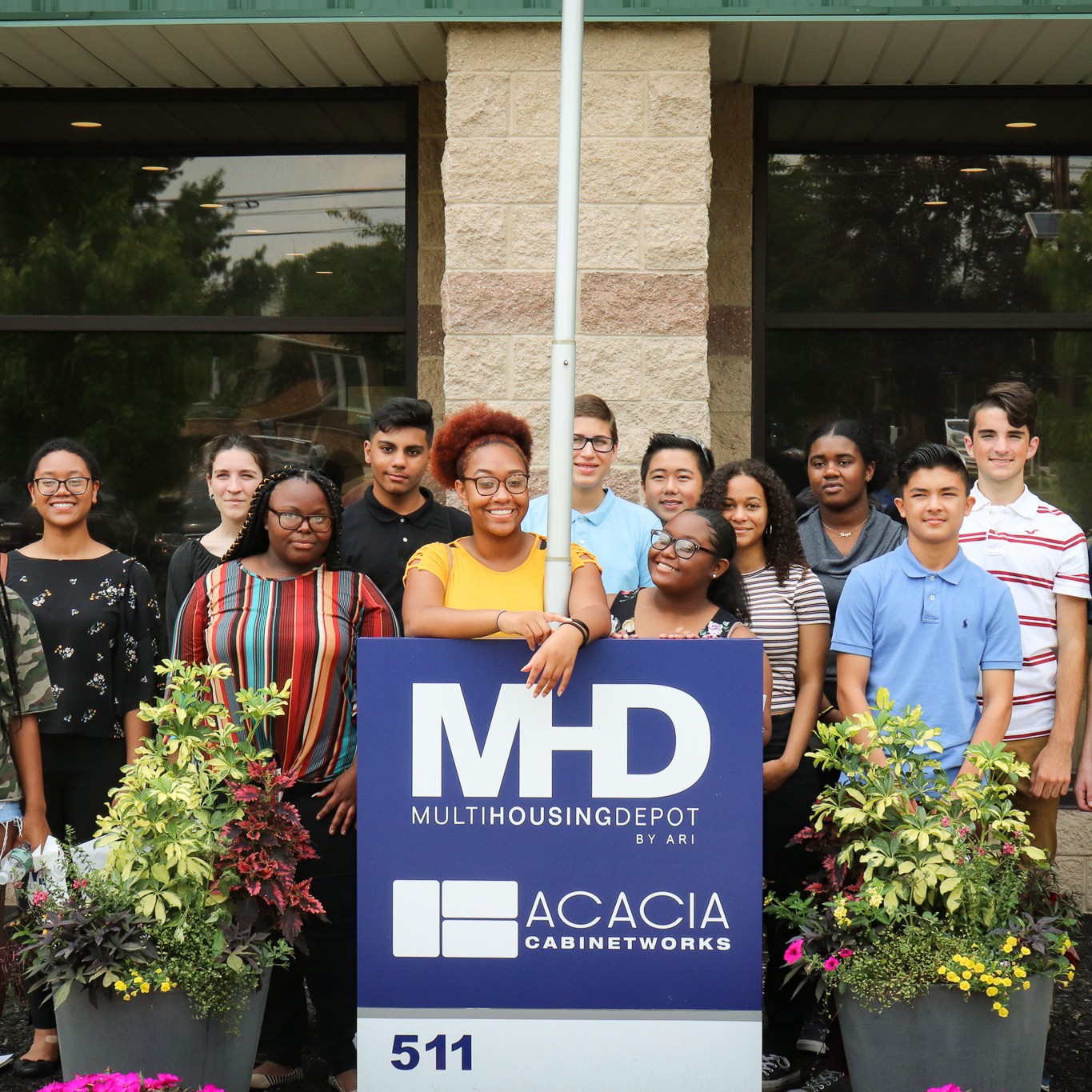 high school students standing in front of MHD building 
