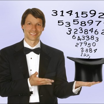 magician holding hat with numbers coming out 