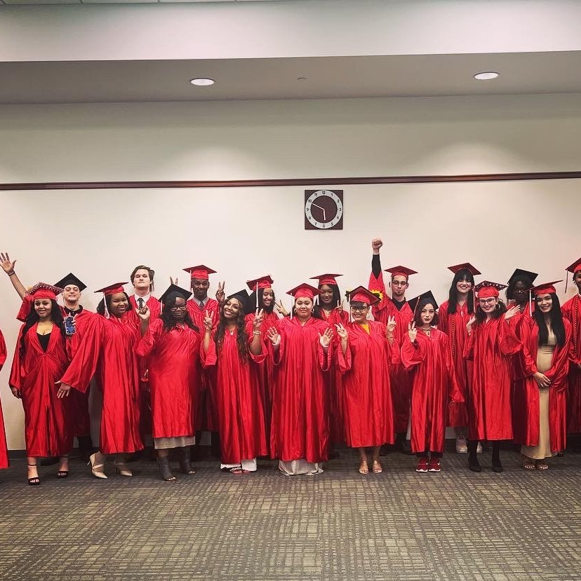 group photo of RCBC Adult Basic Education students posing for graduation ceremony 