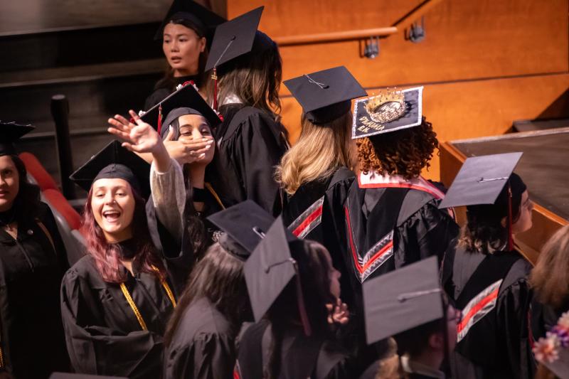 RCBC Nursing students waving at Spring commencement
