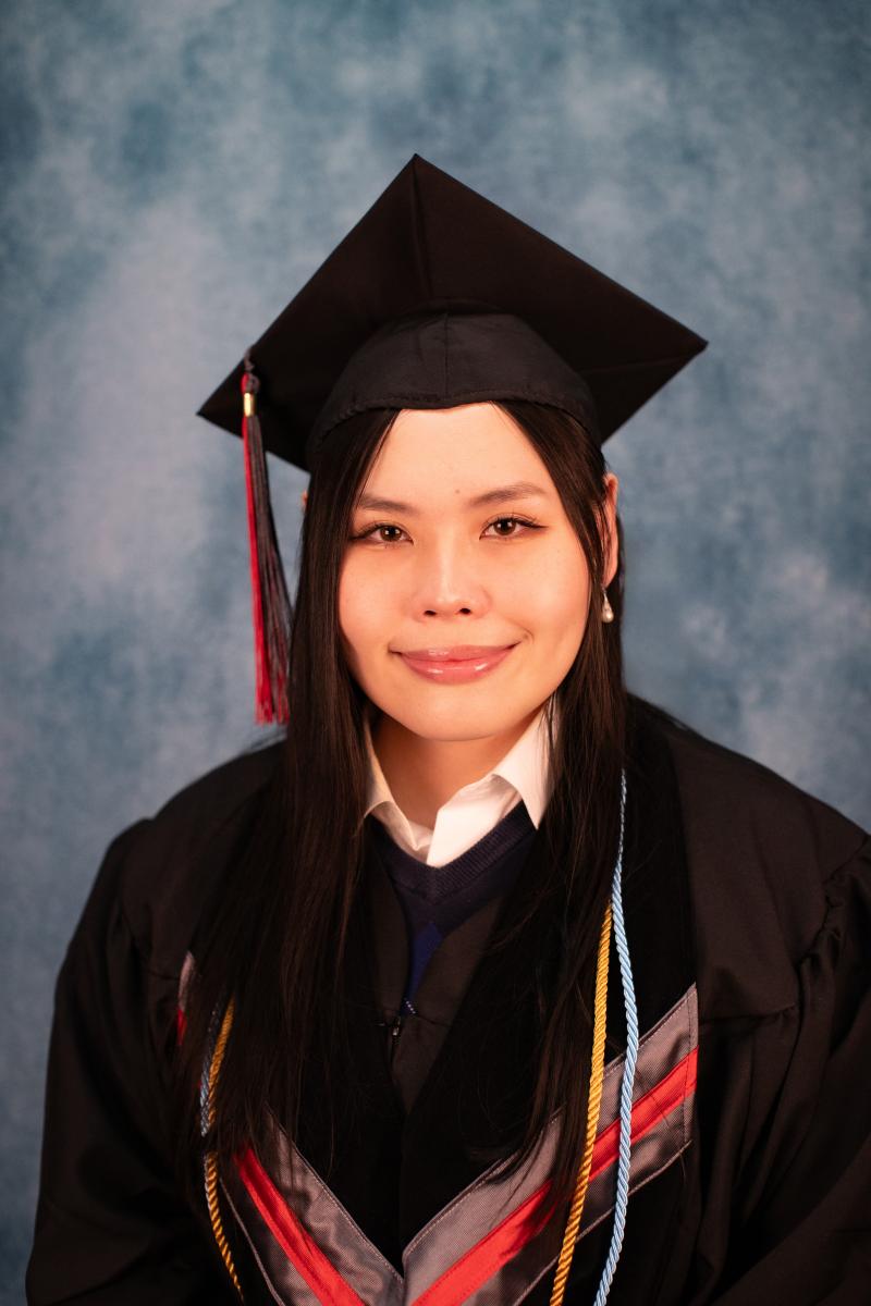 Headshot of Yvonne Tai in graduation regalia.