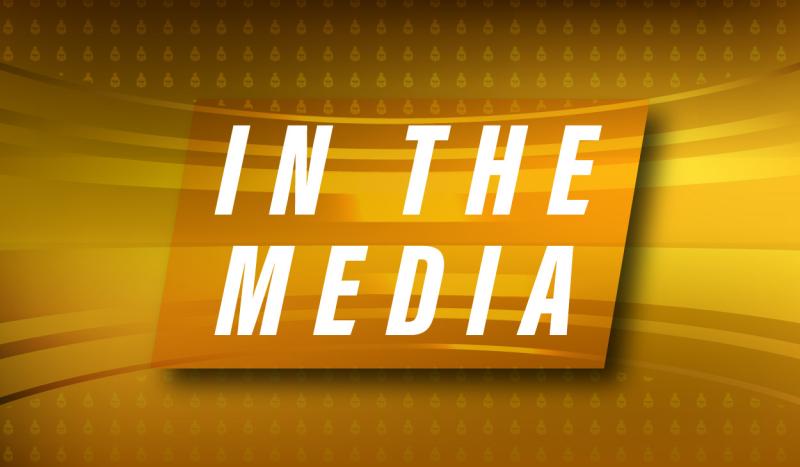 In The Media text with golden background