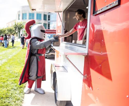 Barry ordering food at Chik-Fil-A food truck