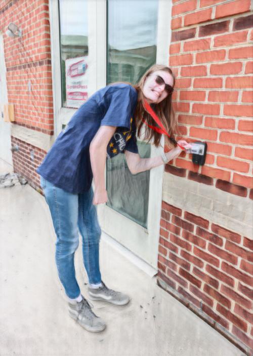 RCBC student using Baron's Pass ID card to access building (photo has crayon filter applied)