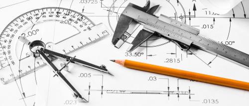Mechanical engineering decorative image using pencil, protractor, and metal caliper 