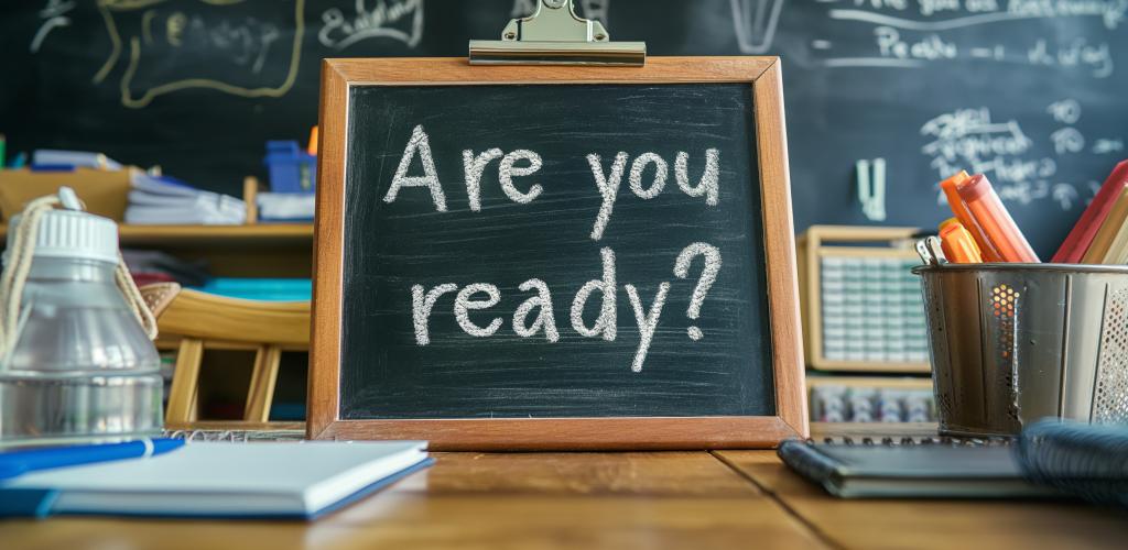 Mini chalk board on desk with the words are you ready