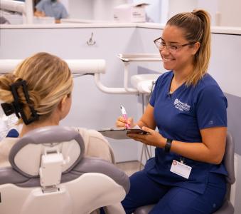 RCBC Dental hygiene student attending to a patient