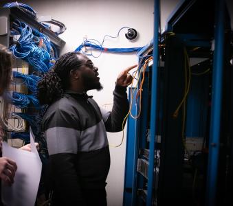 RCBC cybersecurity student inspecting computer servers