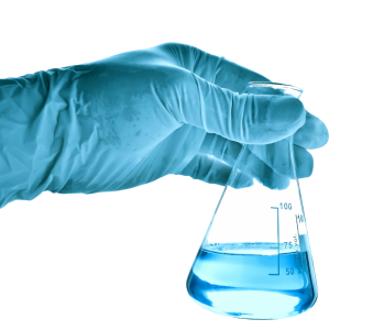rubber gloves and a chemistry beaker holding blue liquid