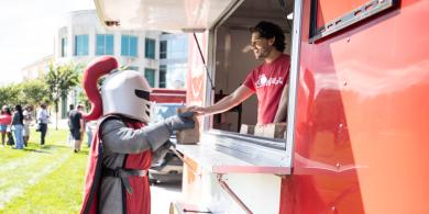 Barry ordering food at Chik-Fil-A food truck