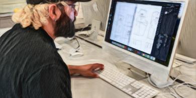 Student using a mac desktop (photo has crayon filter applied)