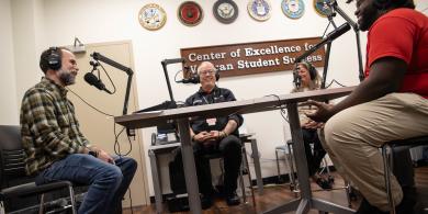 From left to right: Jay Varga, Stephen Hodsdon, Jennifer George, Reginald Taylor chat at microphones.