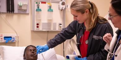 RCBC Nursing student taking a temperature check on a mannequin