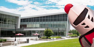 New Barry the mascot peaking around the corner on campus quad