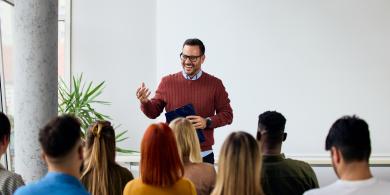 Instructor Leading Engaging Workshop Session With Participants in Modern Bright Room