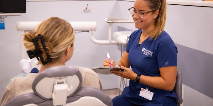 RCBC Dental hygiene student attending to a patient