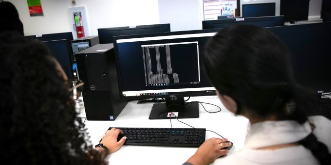cybersecurity students working on coding skills