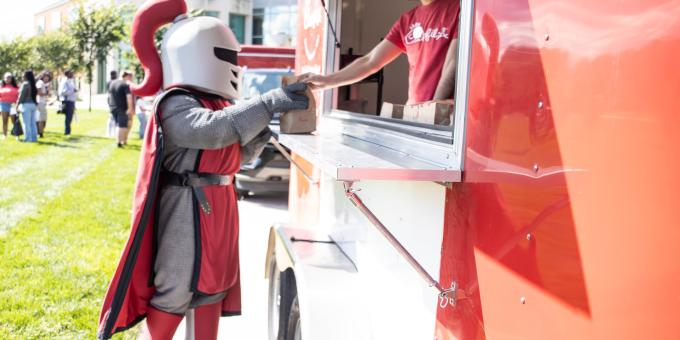 Barry ordering food at Chik-Fil-A food truck