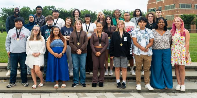 Group photo of EOF staff and students outside on the Student Success Center quad