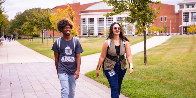 Students walk on campus in the fall.