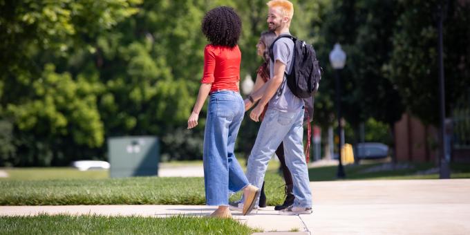 Samarah Schwaeble and Kohen Aselin walk together on campus.