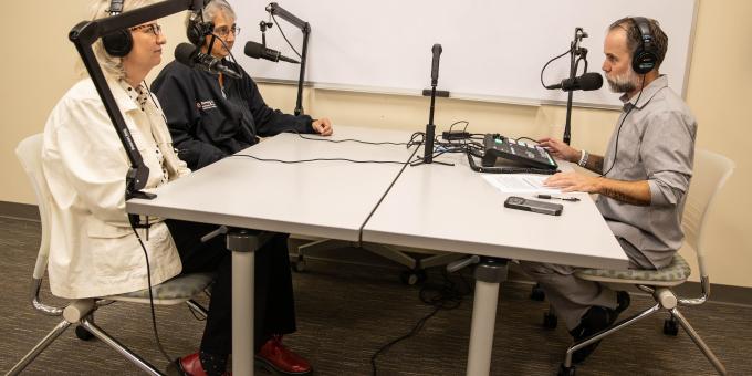 Clockwise from left: Elizabeth Brendle, Faith Zimnes, and Jay Varga chat on the set of the Program Pod.