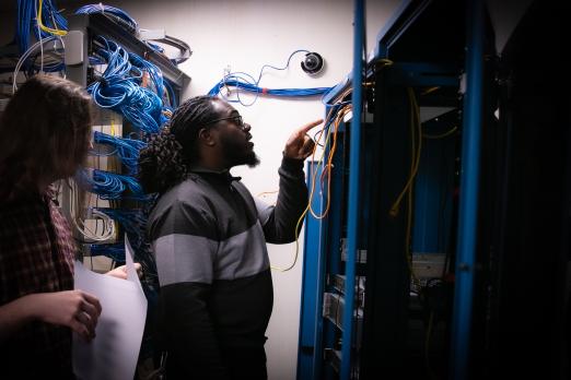 RCBC cybersecurity student inspecting computer servers