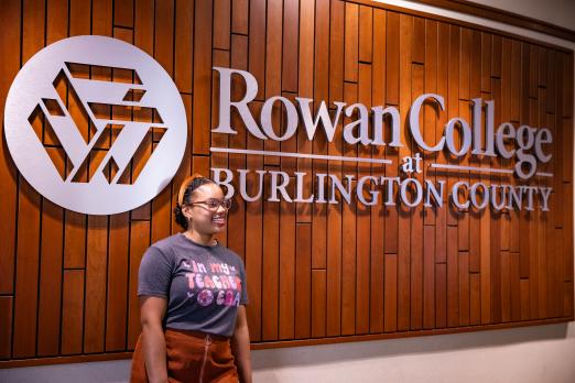 Keyirrah Wilson stands in front of signage in Votta Hall.