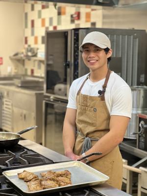 Marcus Juanites poses in the kitchen with his dish.
