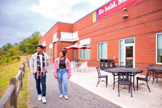 Students walk near the Health Sciences buuilding.