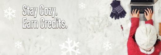 Winter Session graphic design with a student wearing knitted hat and sweater typing on laptop. Graphic states "stay cozy, earn credits."