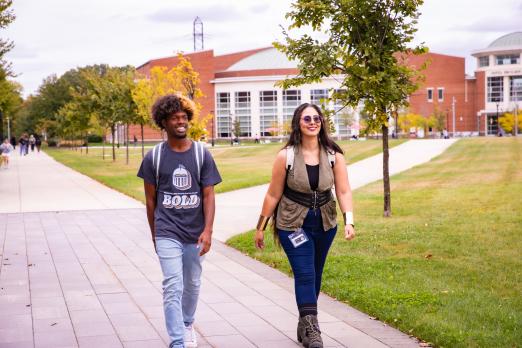 Students walk on campus in the fall.