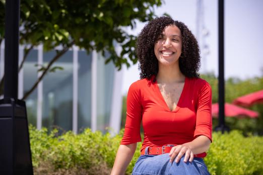 Samarah Schwaeble smiles as she sits outside of the Student Success Center.