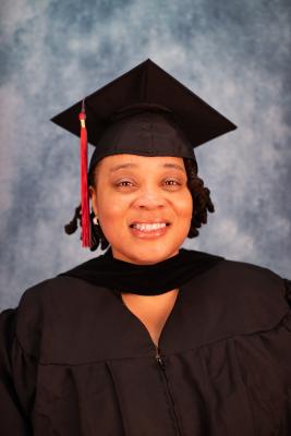 Sherria Hunter headshot wearing graduation regalia.