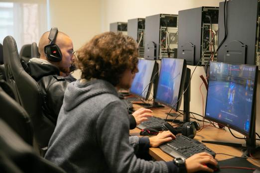 Esports students playing video games on their computers