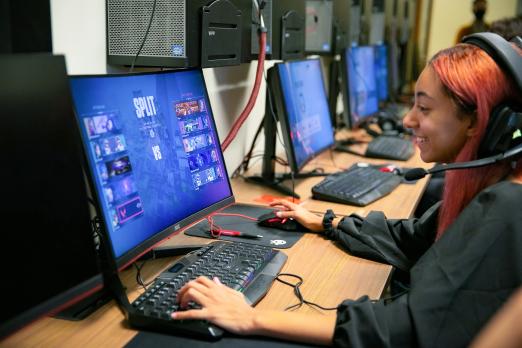 Esports students playing video games on their computers