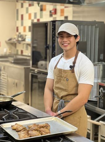 Marcus Juanites poses in the kitchen with his dish.