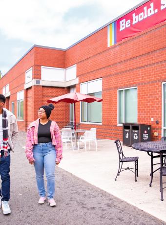 Students walk near the Health Sciences buuilding.
