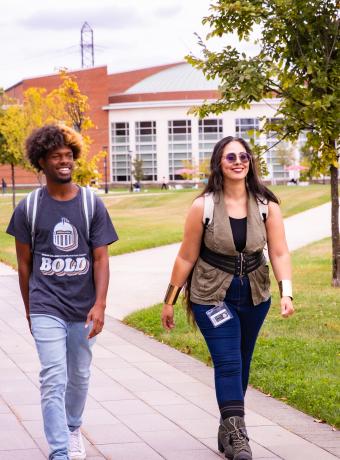 Students walk on campus in the fall.