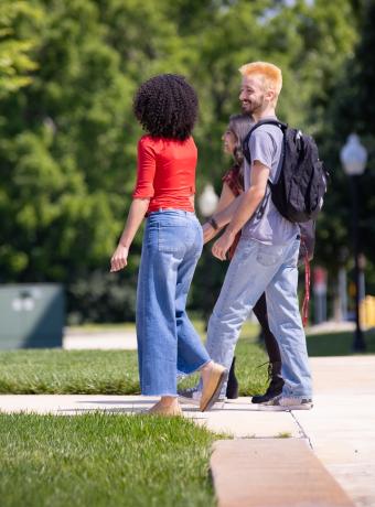 Samarah Schwaeble and Kohen Aselin walk together on campus.