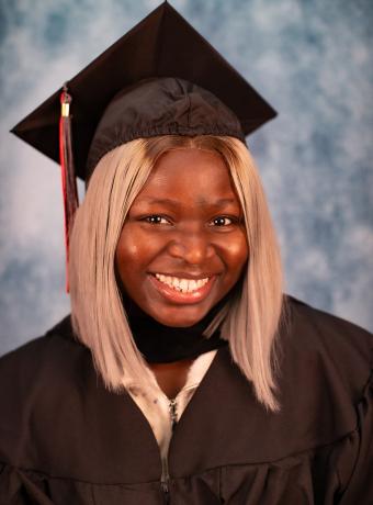 Headshot of Omalayo Akinwole in graduation regalia.