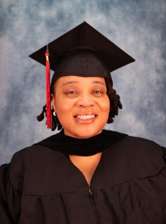 Sherria Hunter headshot wearing graduation regalia.