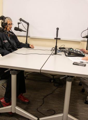 Clockwise from left: Elizabeth Brendle, Faith Zimnes, and Jay Varga chat on the set of the Program Pod.