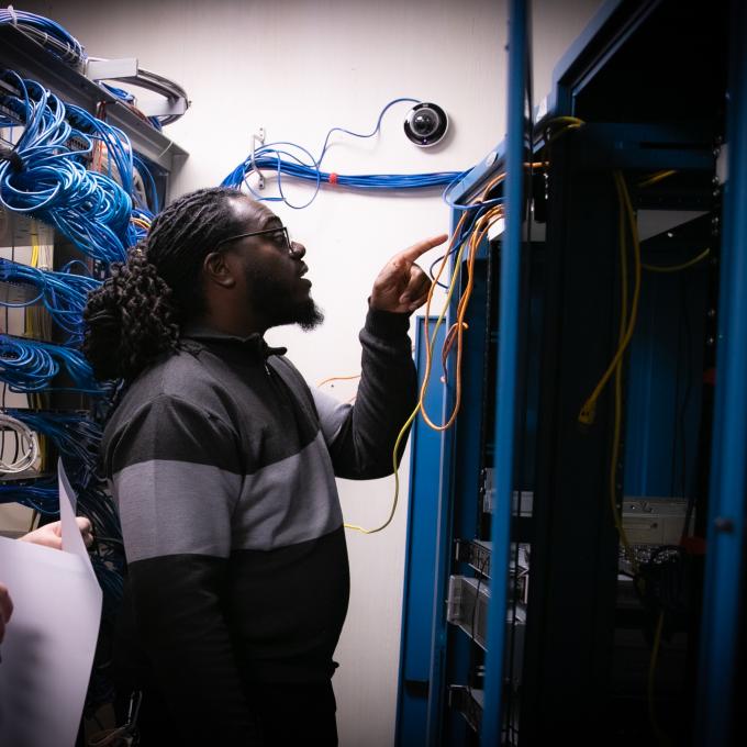 RCBC cybersecurity student inspecting computer servers